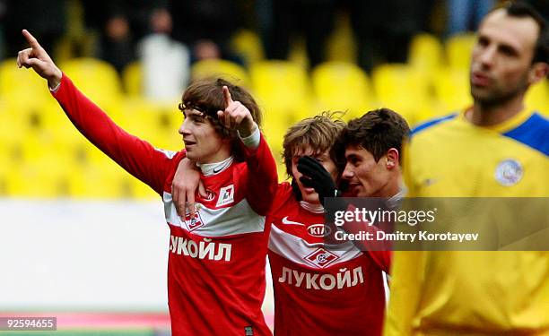 Pavel Yakovlev , Zhano Ananidze and Alex of FC Spartak Moscow celebrate after scoring a goal during the Russian Football League Championship match...