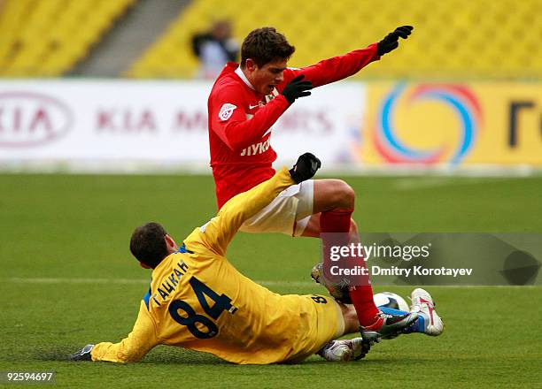 Alex of FC Spartak Moscow battles for the ball with Alexandru Gatcan of FC Rostov Rostov-on-Don during the Russian Football League Championship match...