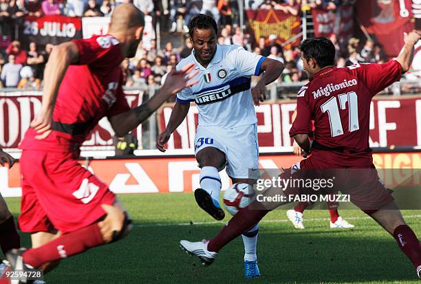 Inter Milan's Amantino Manicini plays against Livorno's Leonardo Miglionico of Uruguay and teammate Mirko Pieri during their seria A soccer match at...