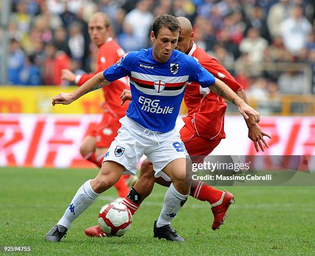 Antonio Cassano of UC Sampdoria battles for the ball against Sergio Bernardo Almiron of AS Bari during the Serie A match between UC Sampdoria and AS...