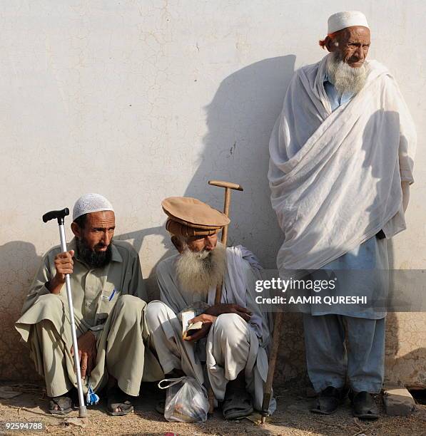 Elderly internally displaced Pakistani civilians, fleeing from military operations against Taliban militants in South Waziristan, wait for relief...