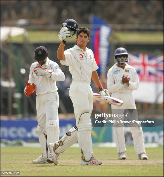 England batsman Alastair Cook celebrates reaching his century during his innings of 118 in the 3rd Test match between Sri Lanka and England at Galle...