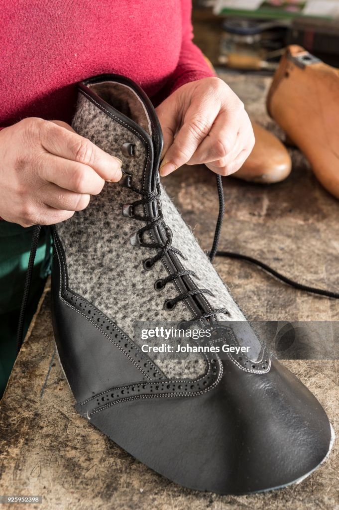 Threading Shoes Shoemaker Woman Threading Laces Through Shoe Upper Beside Lasts On ...