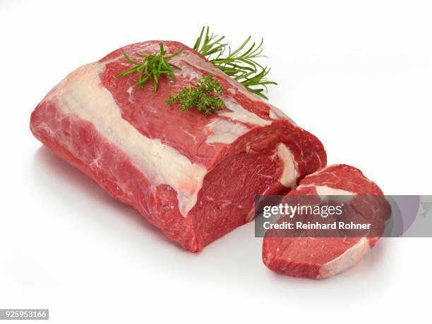 raw entrecote, beef (bos primigenius taurus) with rosemary (rosmarinus officinalis) and thyme (thymus) as decoration, clipping path available - bos taurus primigenius stock pictures, royalty-free photos & images