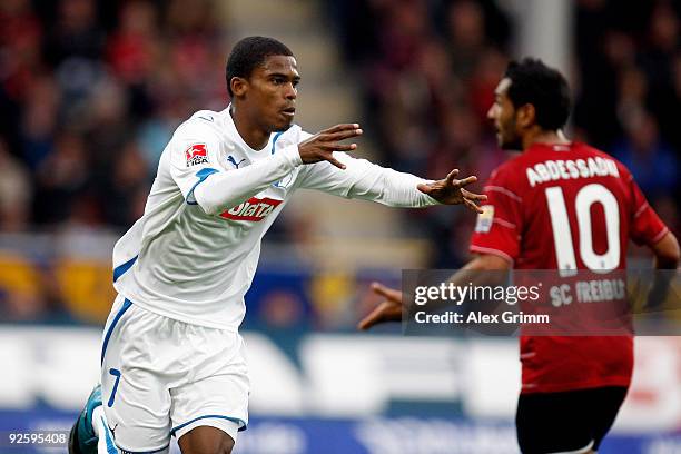 Maicosuel of Hoffenheim celebrates his team's first goal as Yacine Abdessadki of Freiburg reacts during the Bundesliga match between SC Freiburg and...