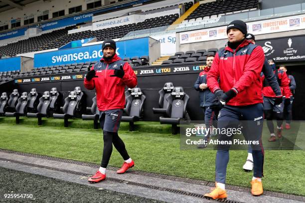 Luciano Narsingh and Martin Olsson enter the pitch during the Swansea City Training at the Liberty Stadium on March 1, 2018 in Swansea, Wales.