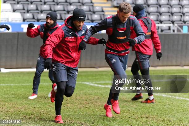 Luciano Narsingh and Andy King in action during the Swansea City Training at the Liberty Stadium on March 1, 2018 in Swansea, Wales.