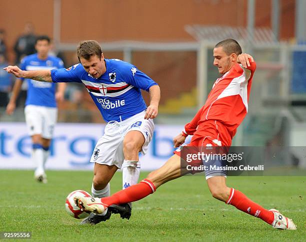 Antonio Cassano of UC Sampdoria is tackled by Leonardo Bonucci of AS Bari during the Serie A match between UC Sampdoria and AS Bari at Stadio Luigi...