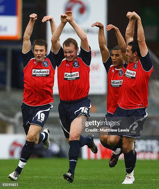 Robbie Williams celebrates his goal with team mates during the Coca-Cola League One match between Oldham Athletic and Huddersfield Town at Boundary...