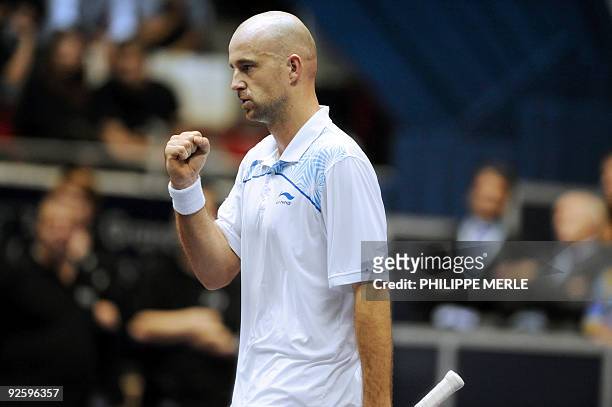 Croatian tennis player Ivan Ljubicic celebrates after winning a point against his French opponent Michael Llodra during the Lyon tennis Grand Prix...