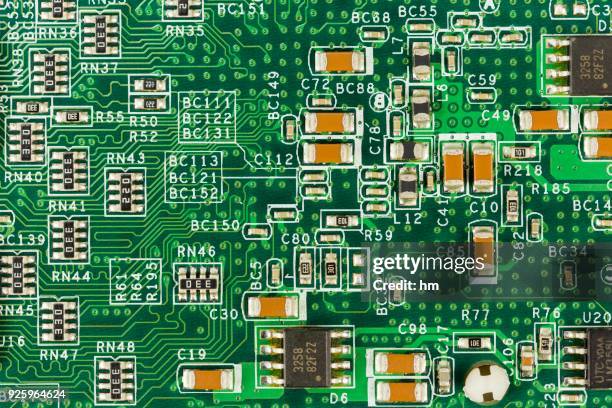 green circuit board with conductive tracks and elements - modern essentials by h&m stock-fotos und bilder