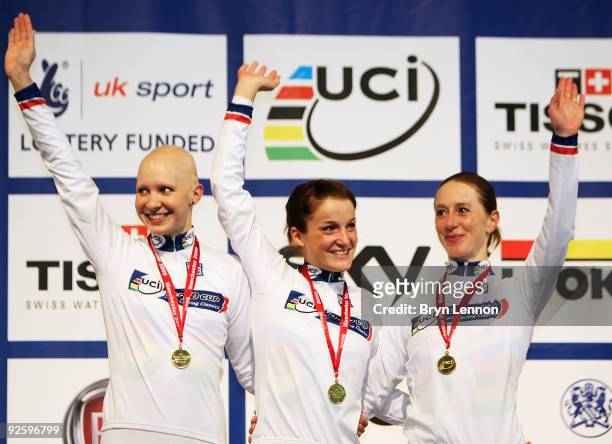 Team GB riders Joanna Rowsell, Elizabeth Armitstead and Wendy Houvengahel celebrate after setting a new world record and winning the Women's Team...