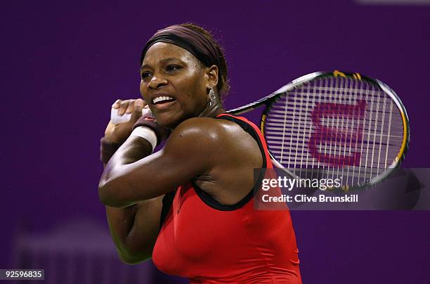 Serena Williams of the USA in action against Venus Williams of the USA in the Women's final during the Sony Ericsson Championships at the Khalifa...