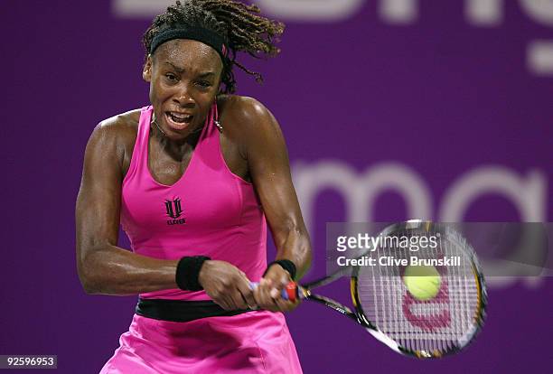 Venus Williams of the USA in action against Serena Williams of the USA in the Women's final during the Sony Ericsson Championships at the Khalifa...