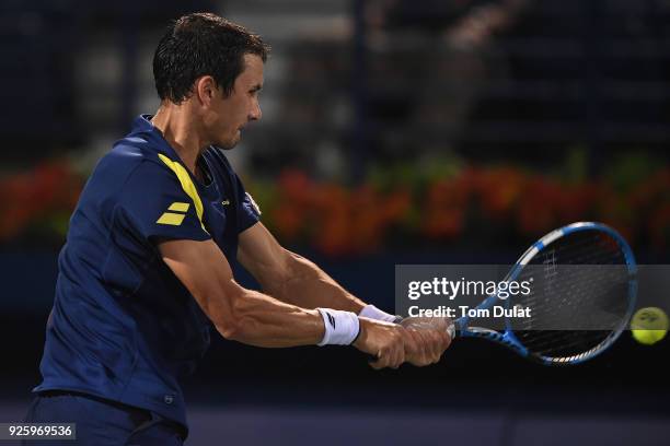 Evgeny Donskoy of Russia plays a backhand during his quarter final match against Filip Krajinovic of Serbia on day four of the ATP Dubai Duty Free...