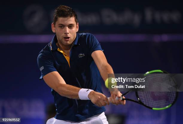 Filip Krajinovic of Serbia plays a backhand during his quarter final match against Evgeny Donskoy of Russia on day four of the ATP Dubai Duty Free...