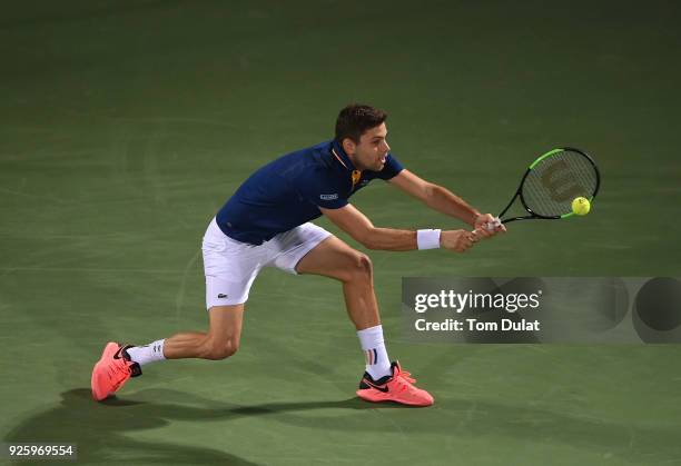 Filip Krajinovic of Serbia plays a backhand during his quarter final match against Evgeny Donskoy of Russia on day four of the ATP Dubai Duty Free...