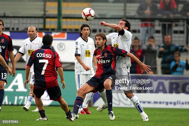 Daniele Conti of Cagliari competes for the ball with Fabio Caserta of Genoa CFC during the Serie A match between Cagliari and Atalanta BC at Stadio...