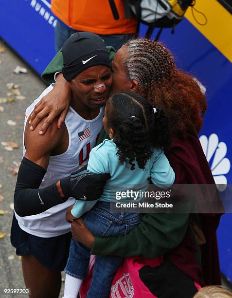 Meb Keflezighi of the USA celebrates with his family after winning the 40th mens ING New York City Marathon on November 1, 2009 in New York City.