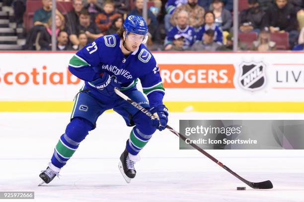 Vancouver Canucks Defenceman Ben Hutton skates with the puck during their NHL game against the New York Rangers at Rogers Arena on February 28, 2018...