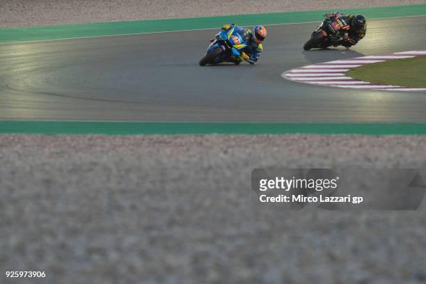 Alex Rins of Spain and Team Suzuki ECSTAR leads Hafizh Syahrin of Malaysia and Monster Yamaha Tech 3 during the MotoGP Testing - Qatar at Losail...
