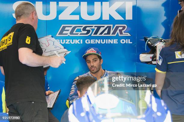 Andrea Iannone of Italy and Team Suzuki ECSTAR speaks wth mechanics in box during the MotoGP Testing - Qatar at Losail Circuit on March 1, 2018 in...