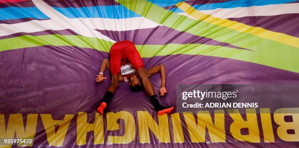 Qatar's Mutaz Essa Barshim competes in the men's high jump final at the 2018 IAAF World Indoor Athletics Championships at the Arena in Birmingham on...