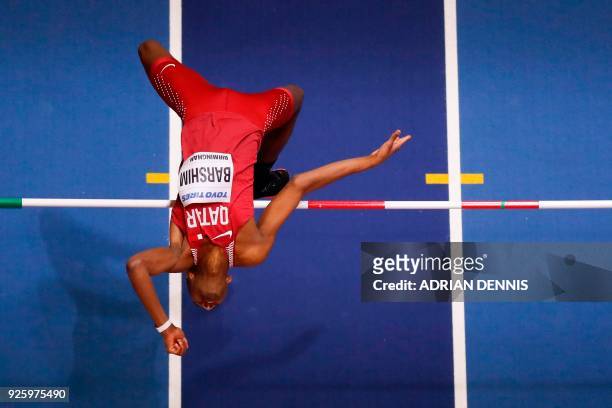 Qatar's Mutaz Essa Barshim competes in the men's high jump final at the 2018 IAAF World Indoor Athletics Championships at the Arena in Birmingham on...