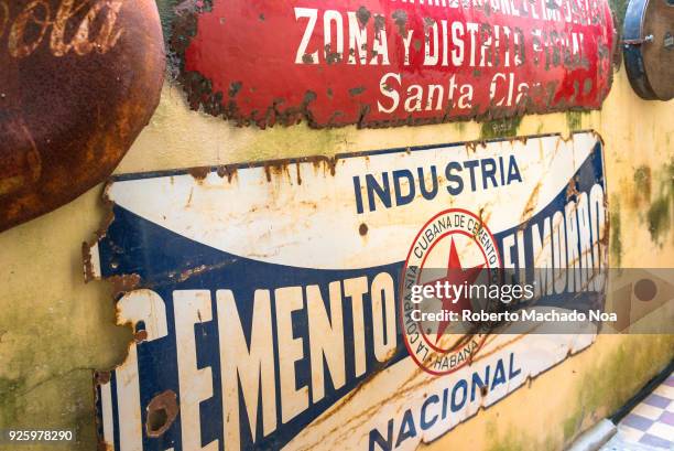 Cemento El Morro' antique metallic sign on a weathered wall. Cafe-Museo Revolucion is full of interesting antiques related to the revolutionary...