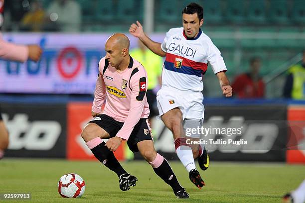 Mark Bresciano of Palermo holds off the challenge from Raffaele Palladino of Genoa during the Serie A match between Palermo and Genoa at Stadio Renzo...
