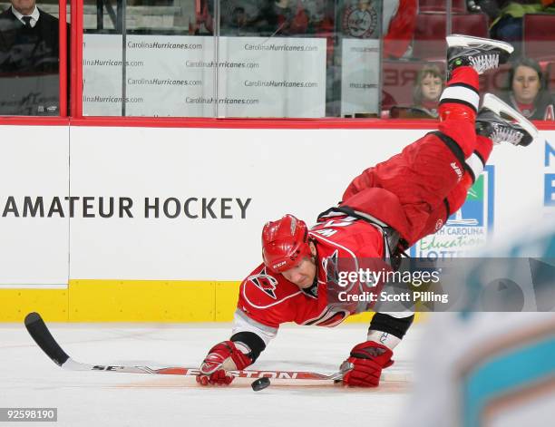 Scott Walker of the Carolina Hurricanes attempts to play the puck in a game against the San Jose Sharks on November 1, 2009 at the RBC Center in...