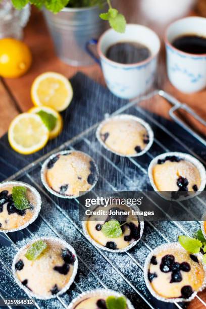 sweet cakes and coffee and lemons - china ware stock pictures, royalty-free photos & images