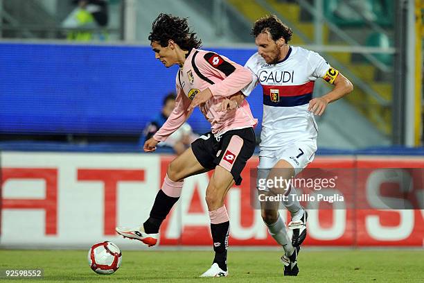 Edinson Cavani of Palermo is challenged by Marco Rossi of Genoa during the Serie A match between Palermo and Genoa at Stadio Renzo Barbera on...