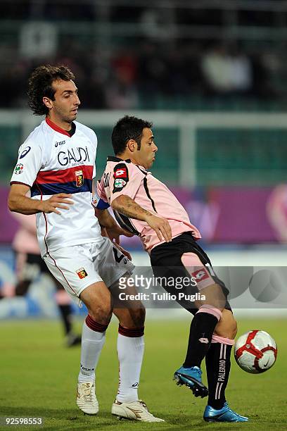 Fabrizio Miccoli of Palermo is challanged by Emiliano Moretti of Genoa during the Serie A match between Palermo and Genoa at Stadio Renzo Barbera on...