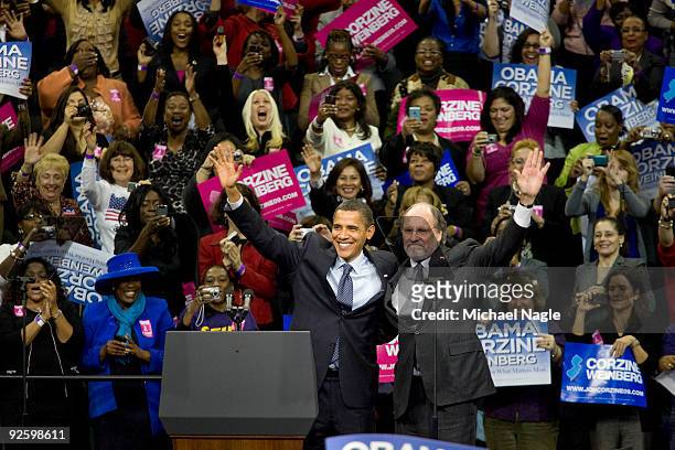 President Barack Obama waves along with New Jersey Gov. Jon Corzine at a campaign rally at the Prudential Center on November 1, 2009 in Newark, New...