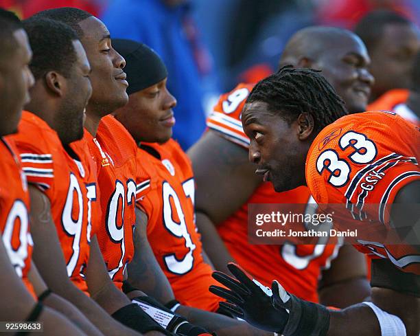 Charles Tillman of the Chicago Bears jokes with teammates on the bench including Anthony Adams, Adewale Ogunleye Mark Anderson and Tommie Harris...