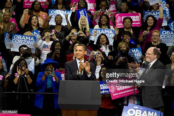 President Barack Obama and New Jersey Gov. Jon Corzine clap at a campaign rally at the Prudential Center on November 1, 2009 in Newark, New Jersey....