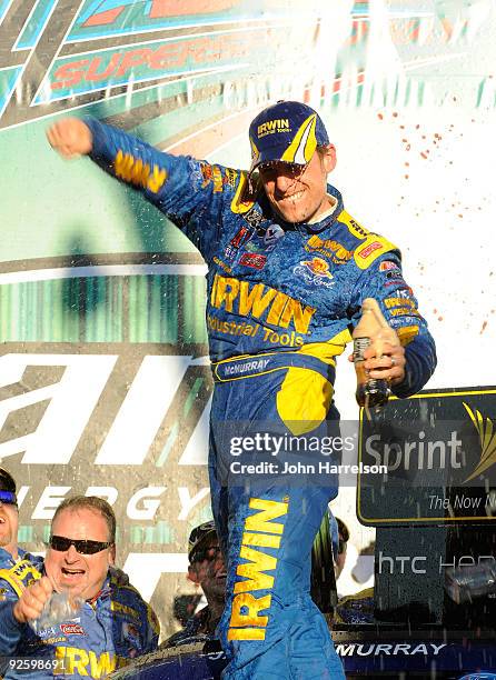 Jamie McMurray, driver of the IRWIN Marathon Ford, celebrates in victory lane after winning the NASCAR Sprint Cup Series AMP Energy 500 at Talladega...