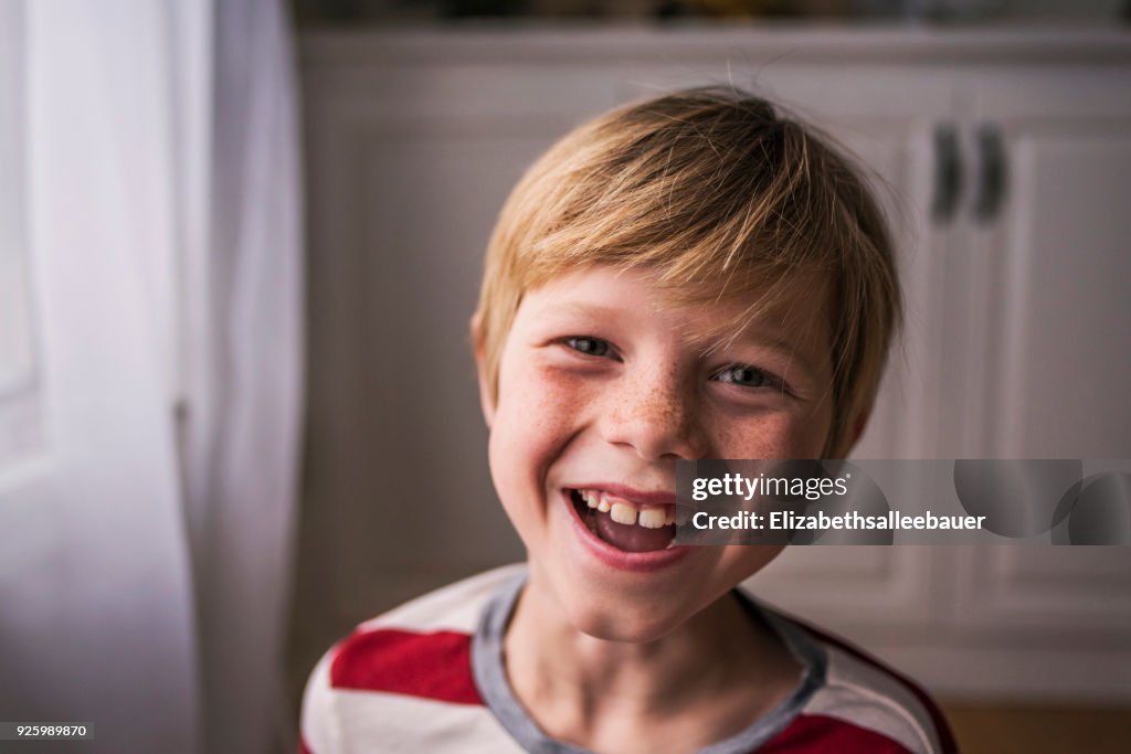 Portrait of a smiling boy with freckles