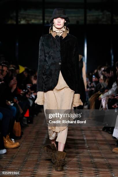 Model walks the runway during the Uma Wang show at Lycee Henry IV as part of the Paris Fashion Week Womenswear Fall/Winter 2018/2019 on March 1, 2018...