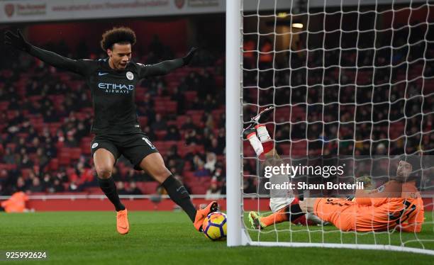 Leroy Sane of Manchester City scores the third goal past Petr Cech of Arsenal during the Premier League match between Arsenal and Manchester City at...