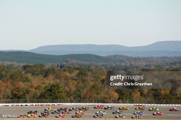 Jeff Burton, driver of the Caterpillar Chevrolet, leads the field during the NASCAR Sprint Cup Series AMP Energy 500 at Talladega Superspeedway on...