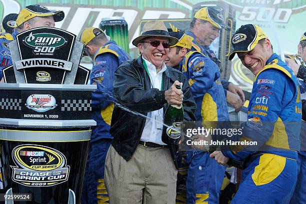 Team owner Jack Roush and Jamie McMurray , driver of the IRWIN Marathon Ford, celebrate in victory lane after winning the NASCAR Sprint Cup Series...