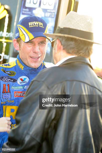 Jamie McMurray , driver of the IRWIN Marathon Ford, and team owner Jack Roush talk in victory lane after winning the NASCAR Sprint Cup Series AMP...