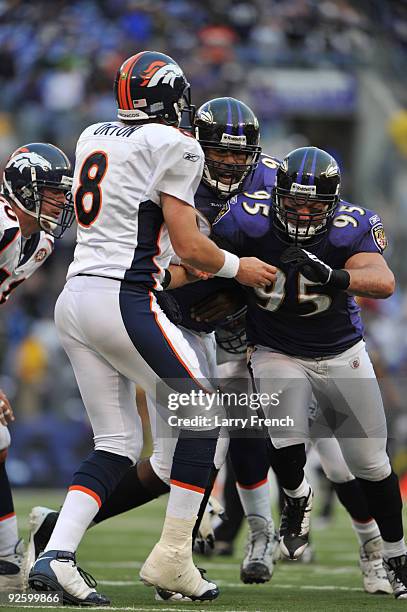 Jarret Johnson of the Baltimore Ravens pressures Kyle Orton of the Denver Broncos at M&T Bank Stadium on November 1, 2009 in Baltimore, Maryland.