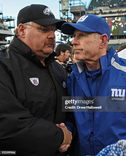 Head coach Andy Reid of the Philadelphia Eagles shakes hands with coach Tom Coughlin of the New York Giants after the game on November 1, 2009 at...