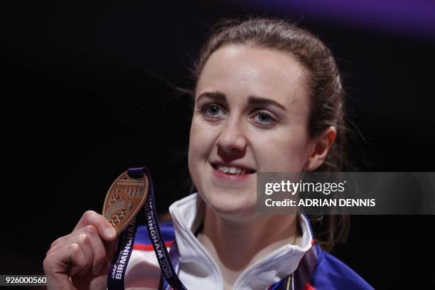 Bronze medallist Britain's Laura Muir poses on the podium during the medal ceremony for the women's 3000m at the 2018 IAAF World Indoor Athletics...