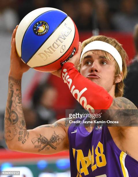 Canadian singer and songwriter Justin Bieber plays during the 2018 NBA All-Star Game Celebrity Game at Los Angeles Convention Center on February 16,...