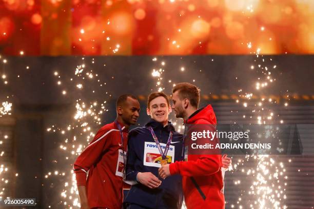 Silver medallist Qatar's Mutaz Essa Barshim, gold medallist Authorised Neutral Athlete Danil Lysenko and bronze medallist Germany's Mateusz Przybylko...