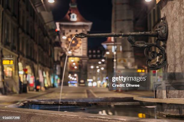 medieval public fountain in bern - bern clock tower stock pictures, royalty-free photos & images